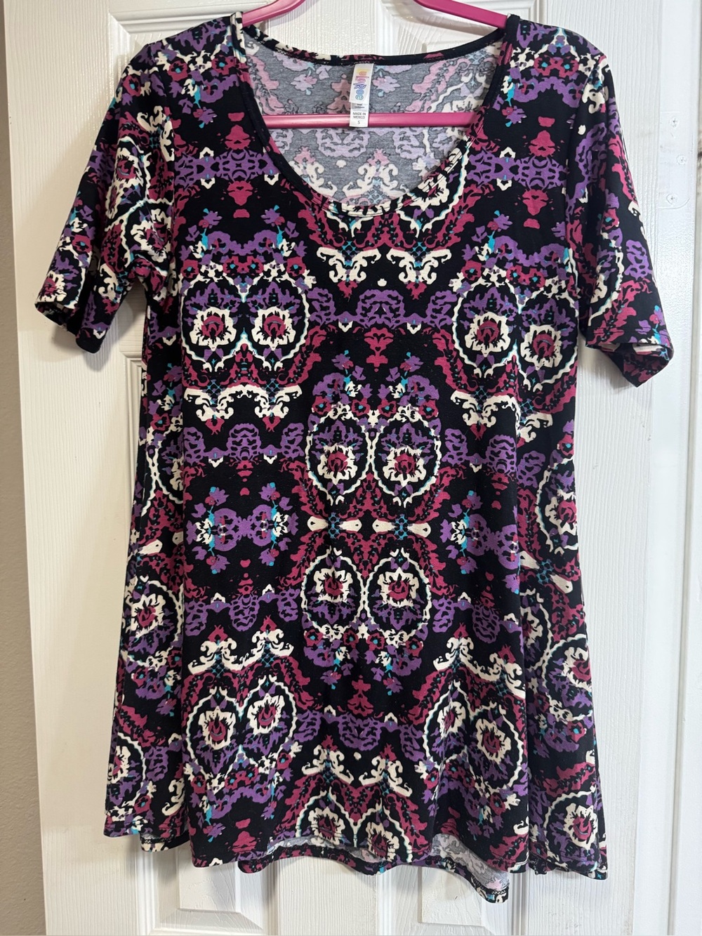 LuLaRoe Perfect Tee. Black w/bright patterns. High low hem. Side slits.